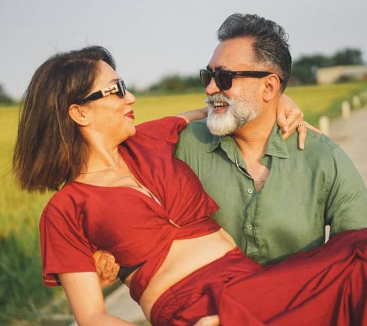 Couple laughing together outdoors